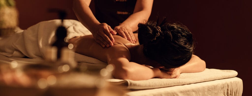 Relaxation woman back massage with masseur in cosmetology spa ce